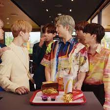 BTS is a korean pop band, it has a meal because McDonalds is "cool" and "hip", a stan is someone who obsesses over a person or group of people.